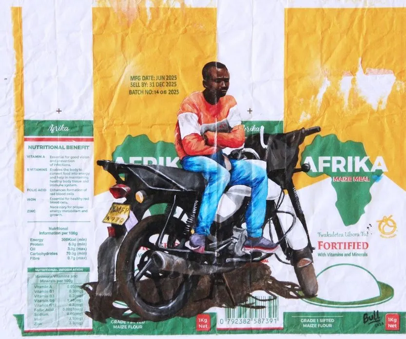 A young man in an orange top sitting astride a motorcycle with his arms folded, painted on Afrika maize meal packaging