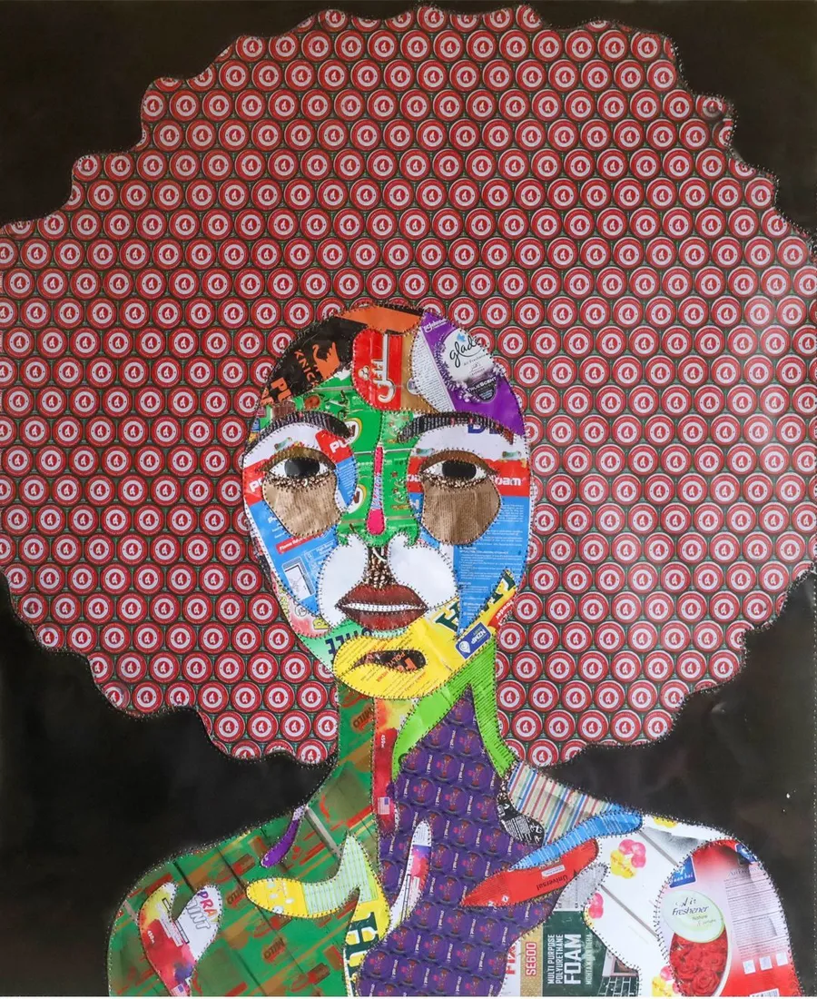 A portrait with a wide halo of pink dotted paper, the face and body built from brightly printed packaging offcuts, on a black ground
