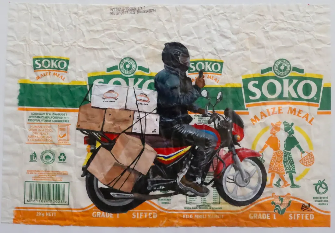 A rider carrying stacked cardboard boxes strapped to a motorcycle, painted onto a Soko maize meal sack