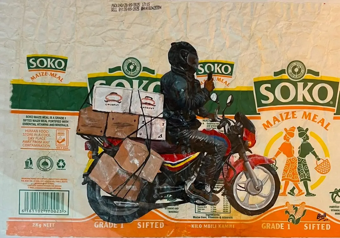 A rider carrying stacked cardboard boxes strapped to a motorcycle, painted onto a Soko maize meal sack