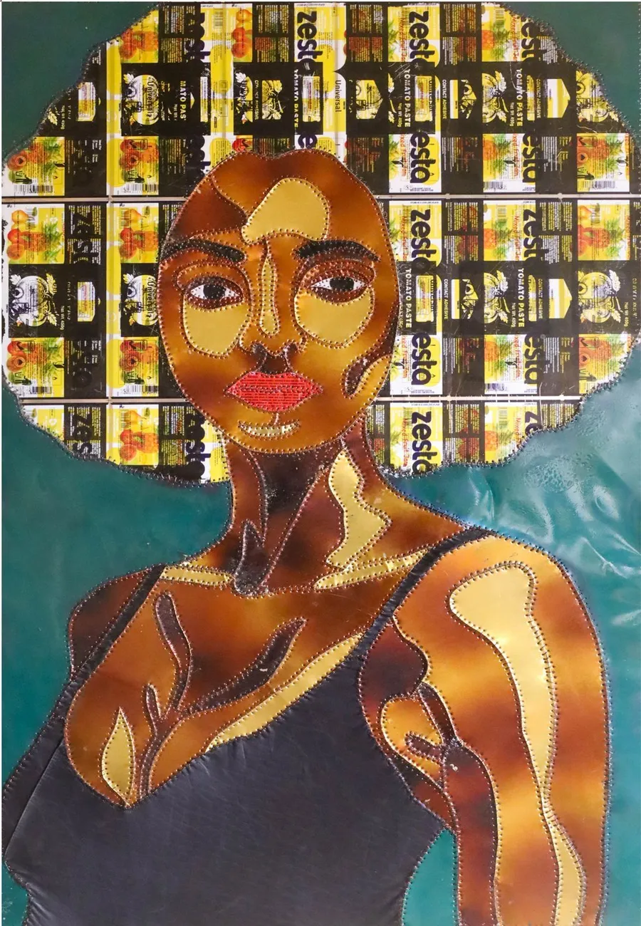 A portrait whose hair is a dense grid of flattened yellow and black tomato paste labels, the face and bare shoulders in warm cut metal, against green