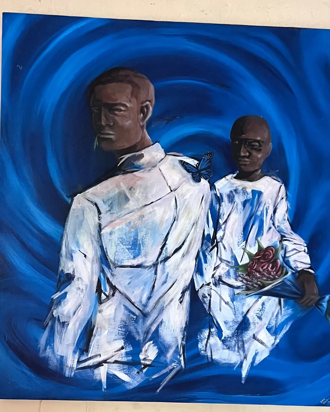 Two figures in loose white clothing standing against a deep blue swirl, one holding a bundle of flowers, a butterfly at the shoulder of the other