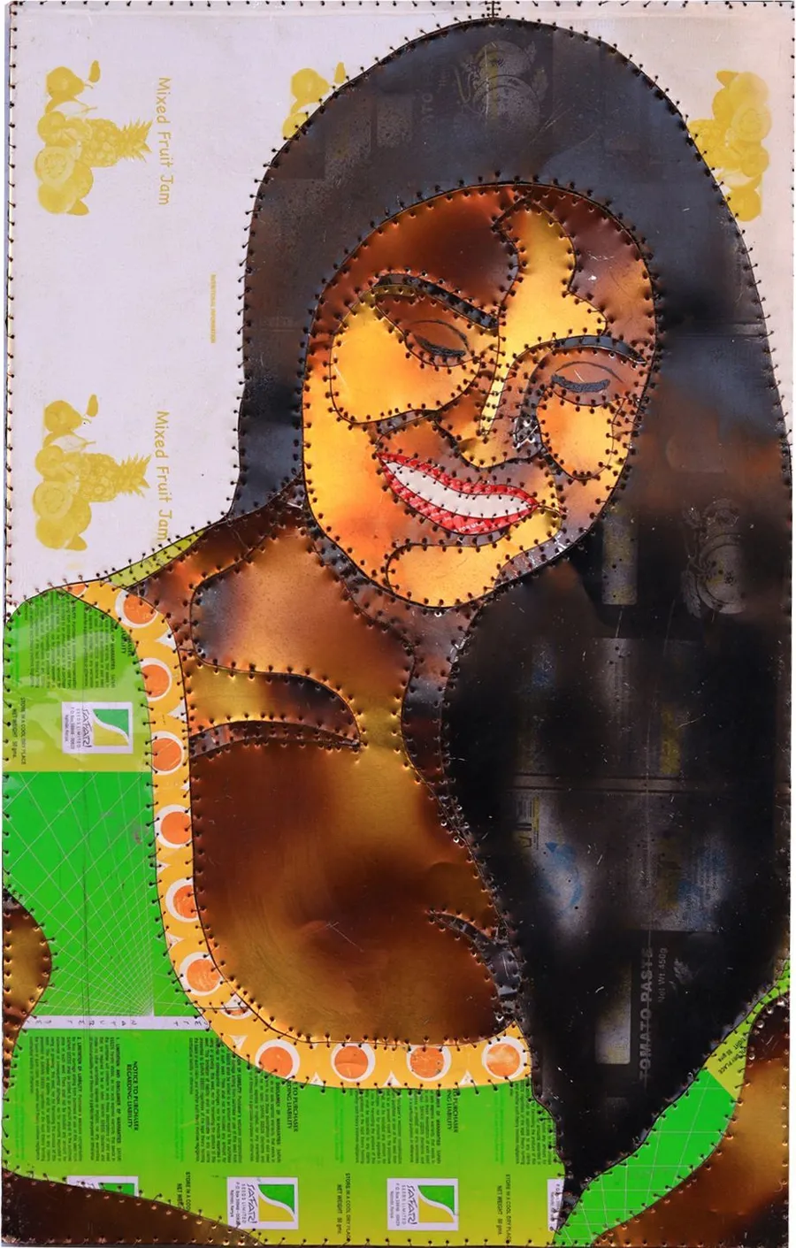 A smiling portrait in warm scorched panels, a green printed top, against pale paper with gold figures