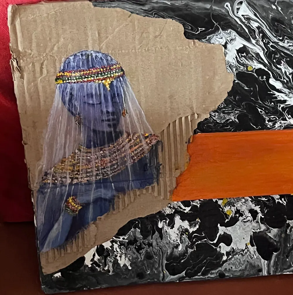 A veiled figure in deep blue with a beaded headdress, cut from corrugated cardboard and set against a poured black and white ground crossed by a single orange band