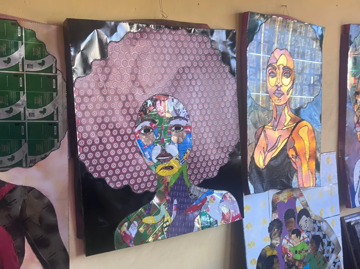 Finished collage panels lined up along the studio wall